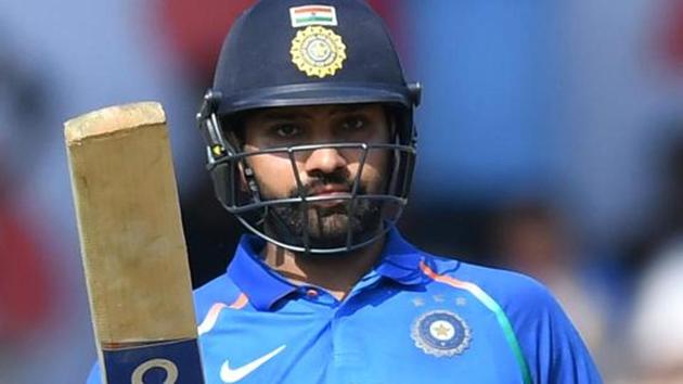 India cricketer Rohit Sharma celebrates after scoring a half century (50 runs) during the fourth one day international (ODI) cricket match between India and West Indies at the Brabourne Stadium in Mumbai on October 29, 2018.(AFP)