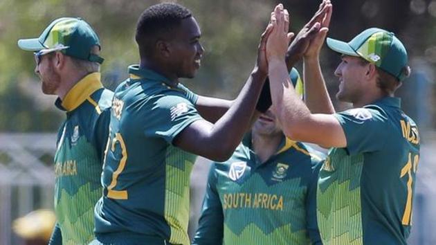 South Africa's Lungi Ngidi (L) celebrates after dismissing Zimbabwe's Kyle Jarvis during the first One Day International cricket match between South Africa and Zimbabwe at the Diamond Oval in Kimberley.(AFP)