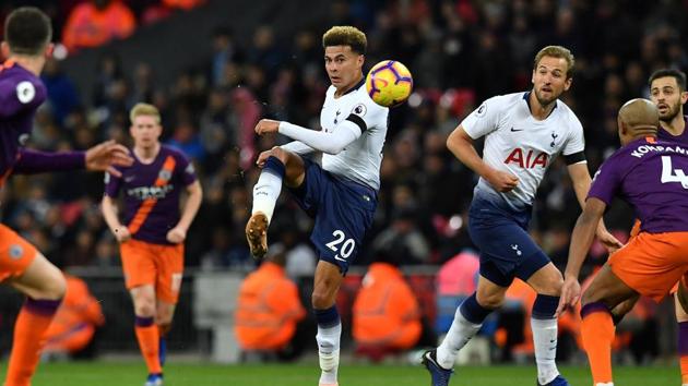 Tottenham Hotspur's English midfielder Dele Alli (C) crosses the ball during the English Premier League football match between Tottenham Hotspur and Manchester City at Wembley Stadium in London.(AFP)