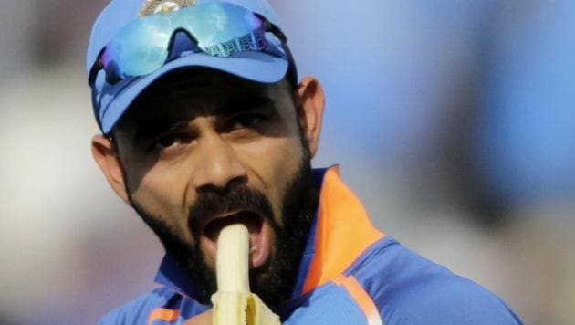 India captain Virat Kohli eats a banana at a drinks break during the third one-day international match between India and West Indies in Pune. (AP) India captain Virat Kohli eats a banana at a drinks break during the third one-day international match between India and West Indies in Pune. (AP)