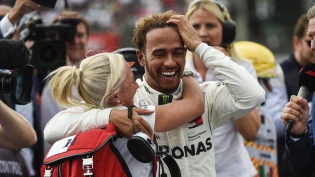 Lewis Hamilton (right) celebrates after winning his fifth drivers' title during the F1 Mexico Grand Prix. (AFP) Lewis Hamilton (right) celebrates after winning his fifth drivers' title during the F1 Mexico Grand Prix. (AFP)