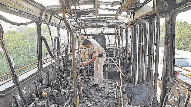 Police personnel inspecting the bus which caught fire on the bridge near Sancheti hospital on Tuesday. Passengers were on the bus when the fire started at the front. However, no casualties or injuries were reported. (Pratham Gokhale/HT Photo) Police personnel inspecting the bus which caught fire on the bridge near Sancheti hospital on Tuesday. Passengers were on the bus when the fire started at the front. However, no casualties or injuries were reported. (Pratham Gokhale/HT Photo)