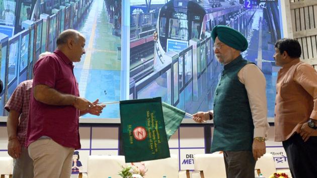 Union Housing and Urban Affairs minister Hardeep Singh Puri (C), Deputy Chief Minister of Delhi Manish Sisodia (L) in the presence of Delhi BJP chief Manoj Tiwari (R) flag off a section of the pink metro line from Trilokpuri Sanjay Lake to Shiv Vihar, at Metro Bhawan in New Delhi. (Sonu Mehta / HT Photo) Union Housing and Urban Affairs minister Hardeep Singh Puri (C), Deputy Chief Minister of Delhi Manish Sisodia (L) in the presence of Delhi BJP chief Manoj Tiwari (R) flag off a section of the pink metro line from Trilokpuri Sanjay Lake to Shiv Vihar, at Metro Bhawan in New Delhi. (Sonu Mehta / HT Photo)