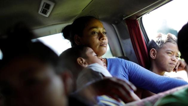 After six hours, Escobar started hitchhiking. Just ahead, Captain Aispuro of the Mexican federal police was flagging down rides for women and children. With no orders to stop the band of travellers, Aispuro said he felt a duty to help. That day, he had found around 10 rides for mothers with children, he said. (Ueslei Marcelino / REUTERS) After six hours, Escobar started hitchhiking. Just ahead, Captain Aispuro of the Mexican federal police was flagging down rides for women and children. With no orders to stop the band of travellers, Aispuro said he felt a duty to help. That day, he had found around 10 rides for mothers with children, he said. (Ueslei Marcelino / REUTERS)