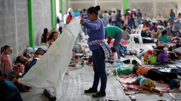 Escobar’s family had had no food or water since residents of Mapastepec provided them a dinner of rice, beans, and eggs about 12 hours earlier. That morning, there had been nothing to eat at the school where they slept on a three-foot square patch of floor, squeezed among dozens of parents with small children. (Ueslei Marcelino / REUTERS) Escobar’s family had had no food or water since residents of Mapastepec provided them a dinner of rice, beans, and eggs about 12 hours earlier. That morning, there had been nothing to eat at the school where they slept on a three-foot square patch of floor, squeezed among dozens of parents with small children. (Ueslei Marcelino / REUTERS)