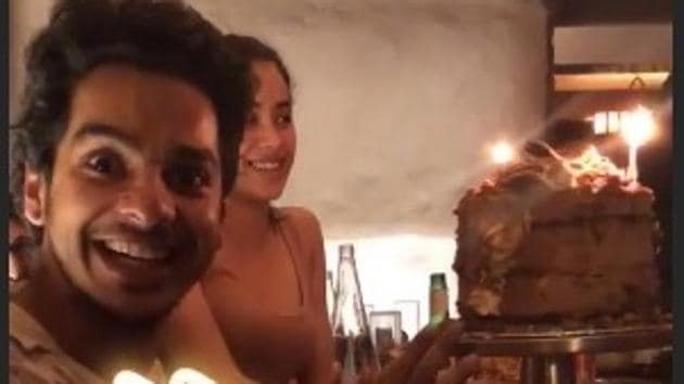 In an Instagram story shared by Mira Rajput, Ishaan Khatter is ecstatic to see his birthday cake. Seated next to him is Janhvi Kapoor. (Instagram) In an Instagram story shared by Mira Rajput, Ishaan Khatter is ecstatic to see his birthday cake. Seated next to him is Janhvi Kapoor. (Instagram)