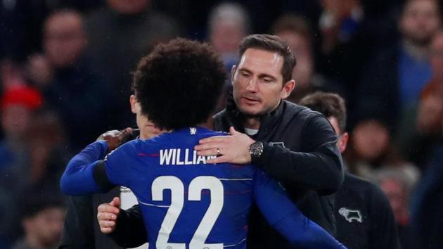 Derby County manager Frank Lampard hugs Chelsea's Willian after the match.(Action Images via Reuters)