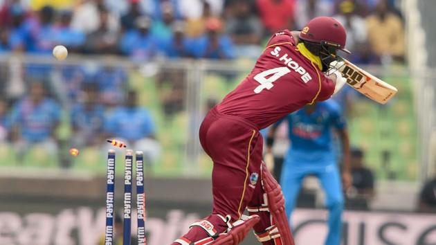 West Indies batsman Shai Hope is bowled out by Indian bowler Jasprit Bumrah. (PTI)