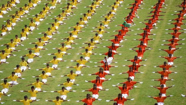 Students perform yoga during the 63rd Karnataka Rajyotsava celebration at Kanteerava Stadium, in Bengaluru on November 01, 2018. (Shailendra Bhojak / PTI) Students perform yoga during the 63rd Karnataka Rajyotsava celebration at Kanteerava Stadium, in Bengaluru on November 01, 2018. (Shailendra Bhojak / PTI)