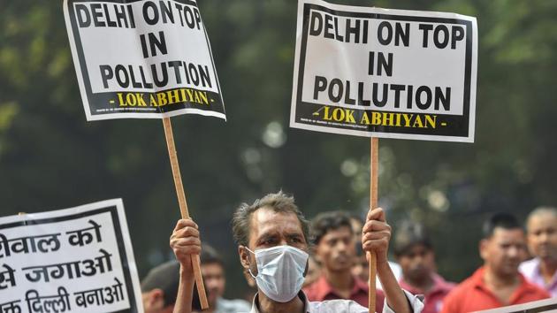 People wear masks as they protest against Delhi Chief Minister Arvind Kejriwal on the issue of air pollution, at Jantar-Mantar in New Delhi. On Thursday, the overall air quality index of Delhi was recorded at 392, which falls in the ‘very poor’ category and is just eight points from turning severe. (Ravi Choudhary / PTI) People wear masks as they protest against Delhi Chief Minister Arvind Kejriwal on the issue of air pollution, at Jantar-Mantar in New Delhi. On Thursday, the overall air quality index of Delhi was recorded at 392, which falls in the ‘very poor’ category and is just eight points from turning severe. (Ravi Choudhary / PTI)