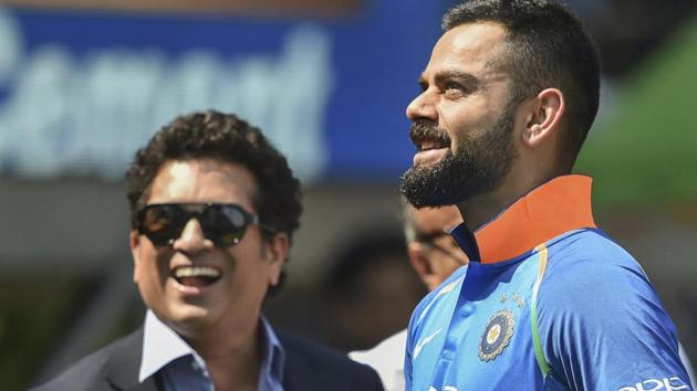Indian batsman Virat Kohli and former cricketer Sachin Tendulkar before the 4th ODI cricket match between India and West Indies at Brabourne Stadium. (AP) Indian batsman Virat Kohli and former cricketer Sachin Tendulkar before the 4th ODI cricket match between India and West Indies at Brabourne Stadium. (AP)