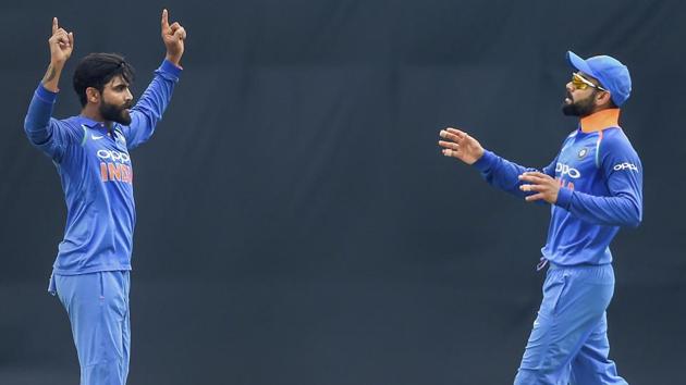 Indian bowler Ravindra Jadeja and Indian captain Virat Kohli celebrate the dismissal of West Indies batsman Marlon Samuels. (AP)