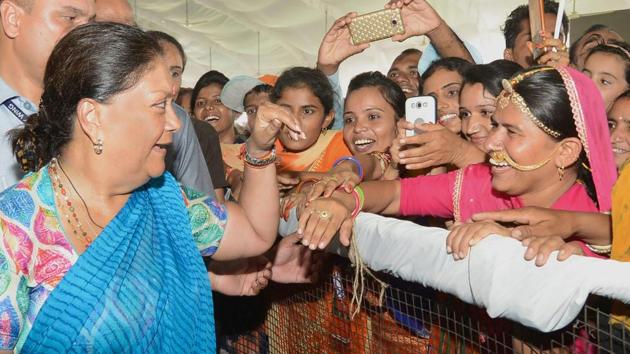 Rajasthan Chief Minister Vasundhara Raje interacts with women in a public rally during her 'Rajasthan Gaurav Yatra' at Gudamalani, near Barmer on Saturday, Sept 1, 2018.(PTI File Photo)