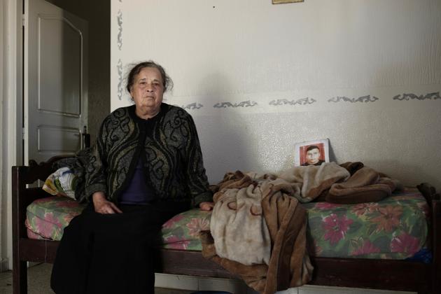 Sofia Al Bahari holds a photo of her son, Majdi Al Barhoumi, who went missing in 2011, at her home in the town of Ras Jabal, Bizerte, Tunisia, on April 12, 2018. As global migration has soared to record highs, far less visible has been its toll: The tens of thousands of people who die or simply disappear during their journeys, never to be seen again. (AP Photo/Nariman El-Mofty) (AP) Sofia Al Bahari holds a photo of her son, Majdi Al Barhoumi, who went missing in 2011, at her home in the town of Ras Jabal, Bizerte, Tunisia, on April 12, 2018. As global migration has soared to record highs, far less visible has been its toll: The tens of thousands of people who die or simply disappear during their journeys, never to be seen again. (AP Photo/Nariman El-Mofty) (AP)