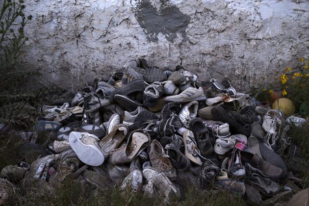 This April 15, 2018 photo shows migrants' shoes which were retrieved by artist Mohsen Lahzib, who tries to create beauty out of sorrow, at his space in the southern port town of Zarzis, Tunisia. (AP Photo/Nariman El-Mofty) (AP) This April 15, 2018 photo shows migrants' shoes which were retrieved by artist Mohsen Lahzib, who tries to create beauty out of sorrow, at his space in the southern port town of Zarzis, Tunisia. (AP Photo/Nariman El-Mofty) (AP)