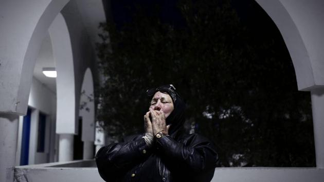Mounira Abu Shakra weeps during an interview about her son, Amin Bin Hussein, who went missing while migrating to Italy. “Europe is protecting its borders but has no interest in the human beings,” said Chamsedding Marzouk, the former sailor who maintains the cemetery of the unknown. “Who will visit the graves of our relatives when they die? Who will visit these graves? Who will weep for them?” (Nariman El-Mofty / AP) Mounira Abu Shakra weeps during an interview about her son, Amin Bin Hussein, who went missing while migrating to Italy. “Europe is protecting its borders but has no interest in the human beings,” said Chamsedding Marzouk, the former sailor who maintains the cemetery of the unknown. “Who will visit the graves of our relatives when they die? Who will visit these graves? Who will weep for them?” (Nariman El-Mofty / AP)