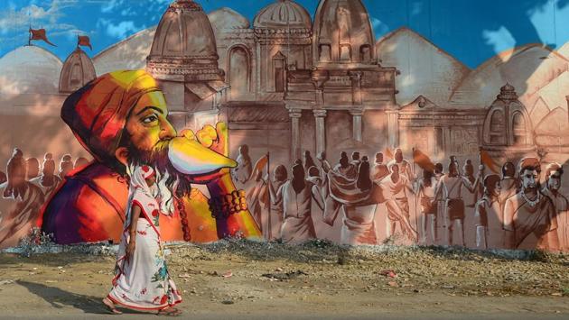 A woman walks past a mural painting at Naini central jail as part of an ongoing project 'Paint my City' for the upcoming Kumbh Mela festival in Prayagraj, Uttar Pradesh on October 29, 2018. (Sanjay Kanojia / AFP) A woman walks past a mural painting at Naini central jail as part of an ongoing project 'Paint my City' for the upcoming Kumbh Mela festival in Prayagraj, Uttar Pradesh on October 29, 2018. (Sanjay Kanojia / AFP)