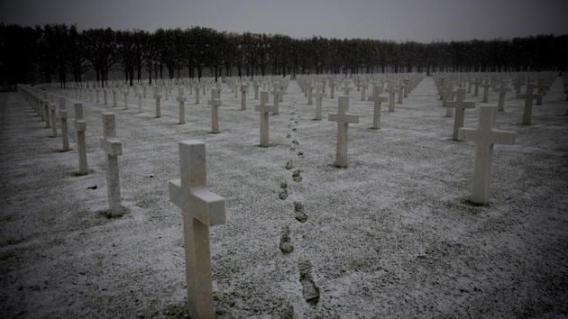 Footsteps are seen as the snow falls at the Meuse-Argonne American WWI cemetery in Romagne-Sous-Montfaucon, France. (Virginia Mayo / AP)