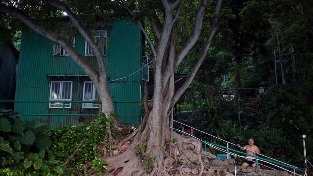 Yin Sing, 83, looks out to sea from the Sai Wan Swimming Shed in Hong Kong. “We’re all friends and we’ve known each other for a long time,” Lam said. “We pay HK$150 ($19) per month which pays for the water and light in the shed, and for the changing rooms to be kept well.” (REUTERS / Hannah McKay) Yin Sing, 83, looks out to sea from the Sai Wan Swimming Shed in Hong Kong. “We’re all friends and we’ve known each other for a long time,” Lam said. “We pay HK$150 ($19) per month which pays for the water and light in the shed, and for the changing rooms to be kept well.” (REUTERS / Hannah McKay)