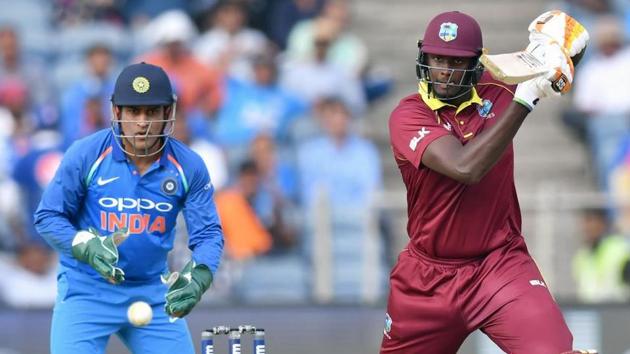West Indies captain Jason Holder (R) plays a shot as India wicketkeeper Mahendra Singh Dhoni watches on. (AFP) West Indies captain Jason Holder (R) plays a shot as India wicketkeeper Mahendra Singh Dhoni watches on. (AFP)