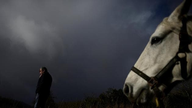 A man makes a phone call at the annual Maam Cross fair in the Connemara region of Maam Cross in Galway, Ireland. (Clodagh Kilcoyne / REUTERS)