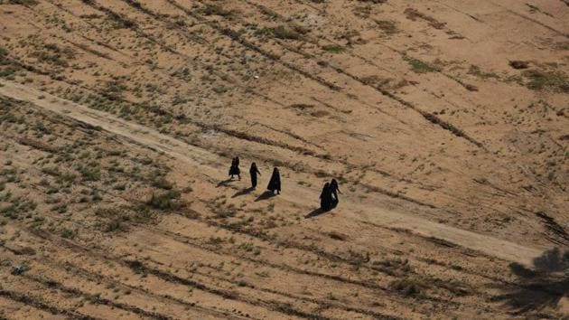 Shiite pilgrims march to holy shrines of Hussein and Abbas for Arbaeen, outside Karbala, Iraq. (Hadi Mizban / AP)