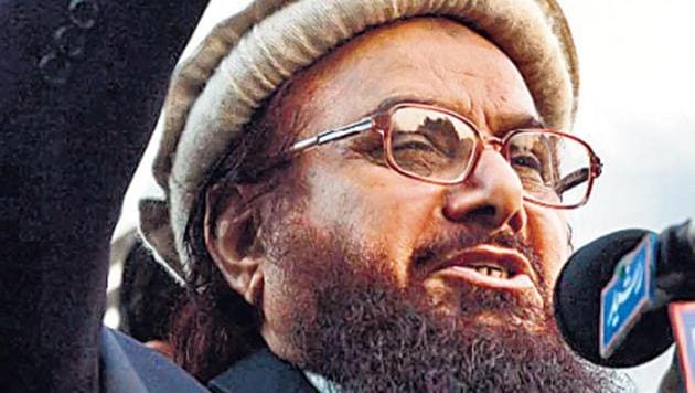 A special NIA court has issued non-bailable warrants against Pakistan-based Lashkar-e-Taiba founder Hafiz Saeed and Hizbul Mujahideen chief Syed Salahuddin for their involvement in terror funding activities, officials said Friday.(HTPhoto)