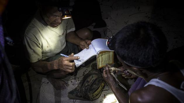 Rangers keep notes near a green turtle nesting ground on Thameehla Island. Poachers are the first danger, even at this conservation site dedicated to the marine reptiles. Turtle eggs can sell for a dollar each, around 10 times the price of a chicken egg. (Ye Aung Thu / AFP) Rangers keep notes near a green turtle nesting ground on Thameehla Island. Poachers are the first danger, even at this conservation site dedicated to the marine reptiles. Turtle eggs can sell for a dollar each, around 10 times the price of a chicken egg. (Ye Aung Thu / AFP)