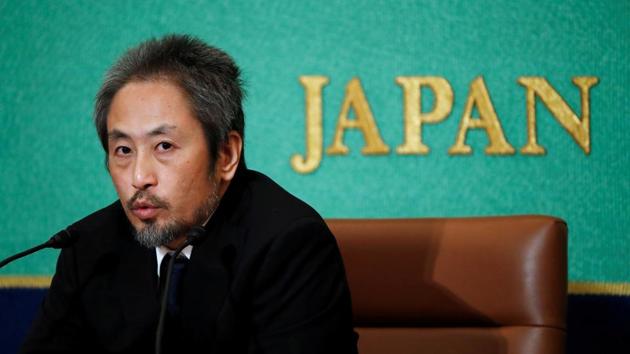 Jumpei Yasuda, the Japanese journalist held in Syria for more than three years, addresses a news conference for the first time since his release last month, at the Japan National Press Club in Tokyo, Japan. (Issei Kato / REUTERS)