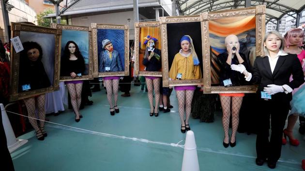 Participants in costumes pose before a Halloween parade in Kawasaki, south of Tokyo, Japan. (Toru Hanai / REUTERS)
