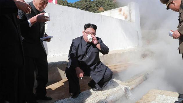 North Korean leader Kim Jong-Un (C) takes a break while inspecting the construction site of the Hot Spring Tourist Area in Yangdok County, South Phyongan Province. (KCNA via KNS / AFP)