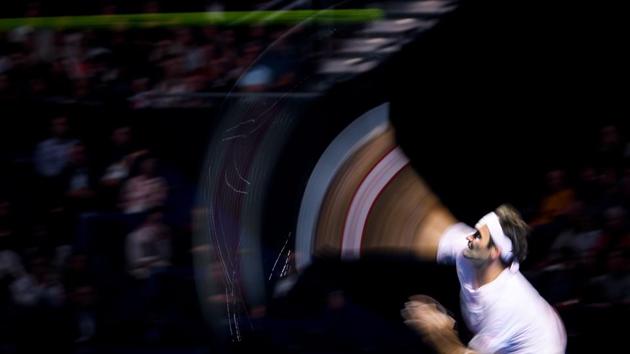 Switzerland’s Roger Federer serves a ball to France’s Gilles Simon during their quarter final match at the Swiss Indoors ATP 500 tennis tournament in Basel, Switzerland. (Fabrice Coffrini / AFP)