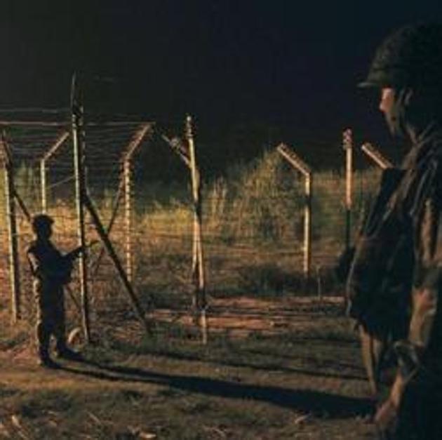 Soldiers guard during a night patrol near the fence at the India-Pakistan International Border at the outpost of Akhnoor sector. (HT File Photo) Soldiers guard during a night patrol near the fence at the India-Pakistan International Border at the outpost of Akhnoor sector. (HT File Photo)