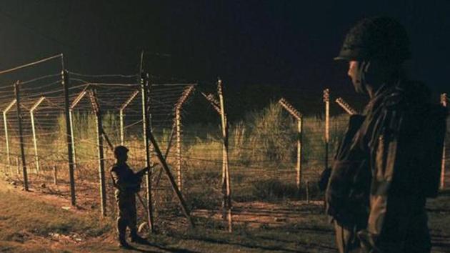 Border Security Force (BSF) soldiers standing guard during a night patrol near the fence at the India-Pakistan International Border. Pakistan on Saturday summoned India’s deputy high commissioner J P Singh and condemned the “unprovoked firing” on the Line of Control by Indian troops that killed a woman. (Representative Image/HT File Photo) Border Security Force (BSF) soldiers standing guard during a night patrol near the fence at the India-Pakistan International Border. Pakistan on Saturday summoned India’s deputy high commissioner J P Singh and condemned the “unprovoked firing” on the Line of Control by Indian troops that killed a woman. (Representative Image/HT File Photo)