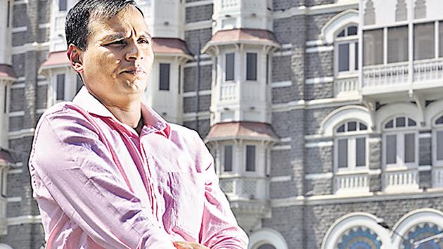 Ex-navy commando Praveen Teotia, a 26/11 attacks survivor, had to undergo five surgeries after being hit by 4 bullets at the Taj Mahal Hotel during the rescue ops. (Anshuman Poyrekar/HT Photo) Ex-navy commando Praveen Teotia, a 26/11 attacks survivor, had to undergo five surgeries after being hit by 4 bullets at the Taj Mahal Hotel during the rescue ops. (Anshuman Poyrekar/HT Photo)