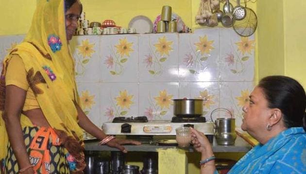CM Vasundhara Raje sips tea at the house of a Ujjwala gas connection scheme beneficiary in Jhalawar, Friday, November 2, 2018. (HT Photo) CM Vasundhara Raje sips tea at the house of a Ujjwala gas connection scheme beneficiary in Jhalawar, Friday, November 2, 2018. (HT Photo)