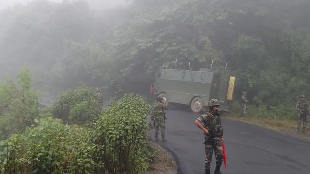 Soldiers guard a road stretch between Imphal and Moreh, a town located on the India-Myanmar border. (HT Photo) Soldiers guard a road stretch between Imphal and Moreh, a town located on the India-Myanmar border. (HT Photo)