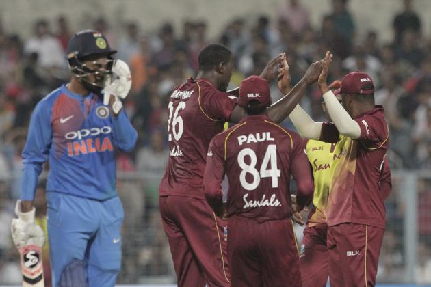 West Indies' captain Carlos Brathwaite, second left, celebrates with teammates the dismissal of India's Lokesh Rahul, left, during the first Twenty20 international cricket match between India and West Indies in Kolkata. (AP)