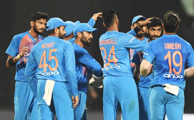 Indian cricketer Jasprit Bumrah (2R) celebrates with teammates after taking the wicket of West Indies cricketer Shimron Hetmyer during the first T20 cricket match between India and West Indies at the Eden Gardens Cricket Stadium in Kolkata. (AFP)