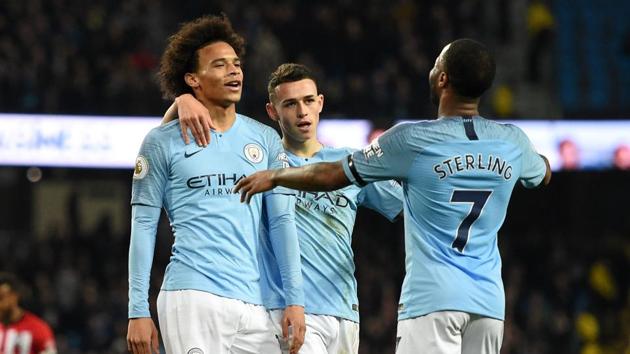 Leroy Sane (L) celebrates with midfielder Phil Foden (C) and midfielder Raheem Sterling (R) after scoring their sixth goal.(AFP)