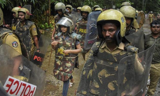 Journalist Kavitha Jakkal being escorted by the police to Sabarimala Temple, Kerala, October 19. Kavitha and activist Rehana Fathima were taken to the temple but the priest, reportedly, locked it and the women had to return mid-way.(PTI)