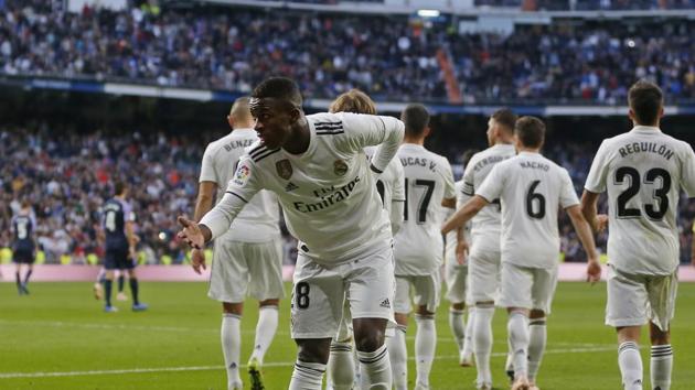 Real Madrid's Vinicius Junior bows to the crowd as he celebrates scoring his side's1st goal during a Spanish La Liga soccer match between Real Madrid and Valladolid at the Santiago Bernabeu stadium in Madrid.(AP)