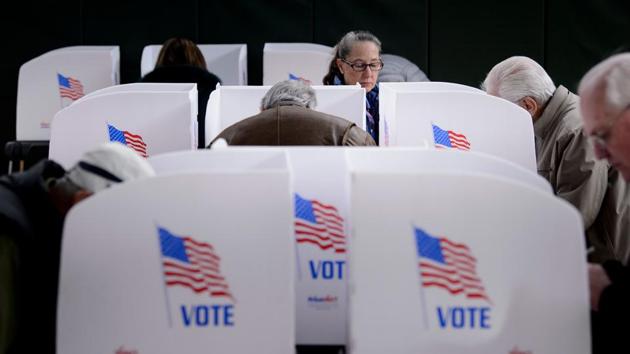 In this file photo taken on October 25, 2018, people cast their ballots at a community center during early voting in Potomac, Maryland, two weeks ahead of the key US midterm polls. (AFP File Photo) In this file photo taken on October 25, 2018, people cast their ballots at a community center during early voting in Potomac, Maryland, two weeks ahead of the key US midterm polls. (AFP File Photo)
