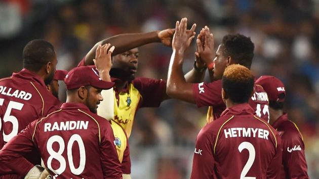 Kolkata: West Indies bowler Oshane Thomas celebrates with teammates after taking a wicket.(PTI)