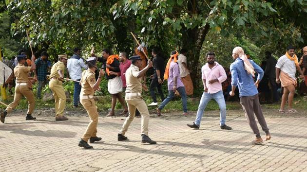 Sabarimala temple opening day LIVE updates: Police lathicharge protesters opposing the entry of girls and women of menstrual age into the hill shrine of Lord Ayyappa in Sabarimala. (PTI/File Photo) Sabarimala temple opening day LIVE updates: Police lathicharge protesters opposing the entry of girls and women of menstrual age into the hill shrine of Lord Ayyappa in Sabarimala. (PTI/File Photo)