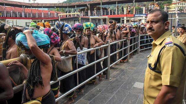 Devotees arrive at Sabarimala temple in Pathanamthitta district in Kerala. (PTI) Devotees arrive at Sabarimala temple in Pathanamthitta district in Kerala. (PTI)