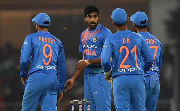 Indian bowler Jasprit Bumrah (C) celebrates with teammates after his dismissal of unseen West Indies batsman Kieron Pollard during the second T20 cricket match between India and West Indies at The Bharat Ratna Atal Bihari Vajpayee Ekana Cricket Stadium in Lucknow . (AFP)
