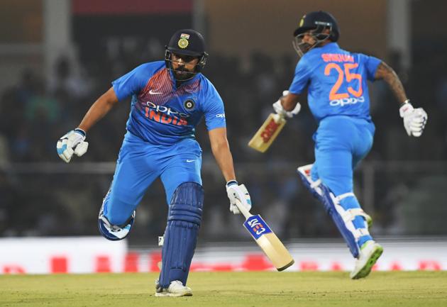 Indian cricket captain Rohit Sharma (L) and teammate Shikhar Dhawan (R) run between the wickets during the second T20 cricket match between India and West Indies at the Bharat Ratna Atal Bihari Vajpayee Ekana Cricket Stadium in Lucknow. (AFP)