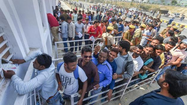 Lucknow: Cricket fans queue up to buy tickets at Ekana Stadium in Lucknow. (PTI)
