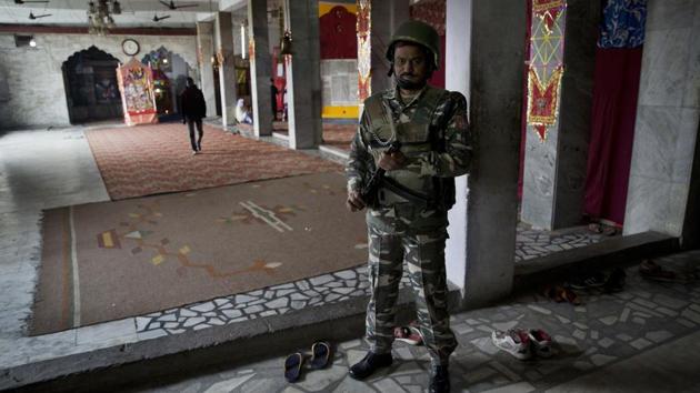 An Indian soldier guards a Hindu temple in Srinagar. Back in the day, the House of the Lord had 212 guards — or so the Old Testament book of Chronicles says — “toward the east, west, north and south.” “You must feel safe to pray,” said the Rev. Patrick Desbois, a French Holocaust researcher, priest and advocate for Yazidi people in Iraq. “If you are praying and you have an eye on the back door, it is very difficult.” (Dar Yasin / AP)